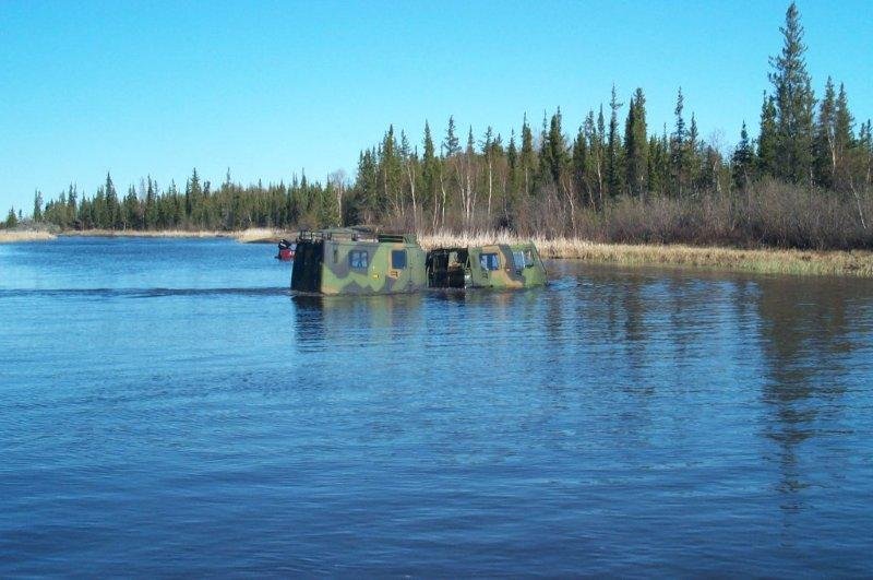 Amphibious Hagglunds BV206 Crossing a Lake